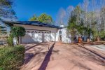 View of paved driveway & garage